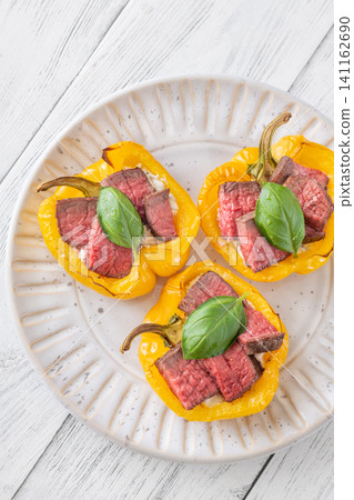 Roasted Yellow Bell Peppers Stuffed With Cream Cheese And Juicy Steak Slices Roasted Yellow Bell Peppers Stuffed With Cream Cheese And Juicy Steak Slices 141162690