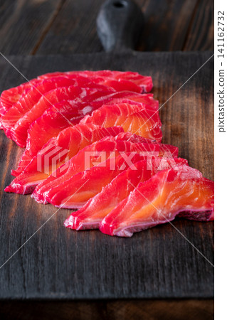 Gourmet Beetroot Gravlax Slices On Dark Wooden Background Premium Presentation Gourmet Beetroot Gravlax Slices On Dark Wooden Background Premium Presentation 141162732