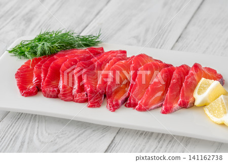 Premium Nordic Salmon Gravlax Appetizer With Herbs And Citrus Garnish 141162738