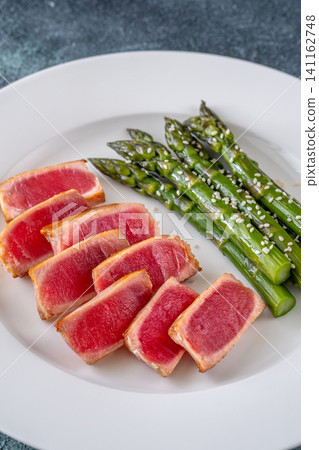 Perfectly Seared Yellowfin Tuna Steak With Asparagus And Sesame Seeds 141162748