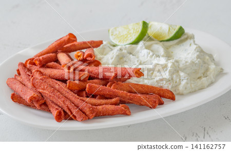 Spicy Takis Fuego Served With Garlic Herb Cream Cheese Dip Spicy Takis Fuego Served With Garlic Herb Cream Cheese Dip 141162757