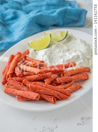 Spicy Takis Fuego Served With Garlic Herb Cream Cheese Dip Spicy Takis Fuego Served With Garlic Herb Cream Cheese Dip 141162758