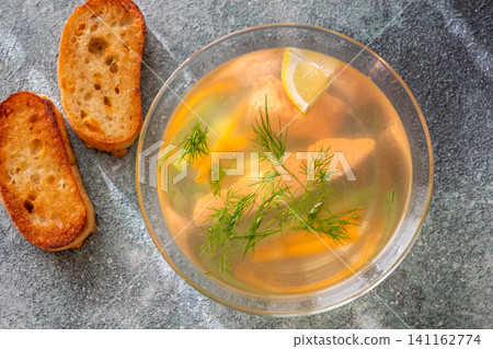Healthy Nordic Clear Salmon Soup With Fresh Dill Lemon And Vegetables In Glass Bowl Healthy Nordic Clear Salmon Soup With Fresh Dill Lemon And Vegetables In Glass Bowl 141162774