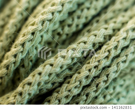 Ball of yarn on the table. Material for knitting. Ball of yarn on the table. Material for knitting. 141162831