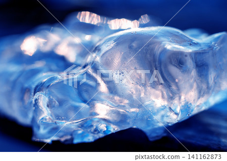 Beautiful abstract background. Ice close-up. The play of light. Beautiful abstract background. Ice close-up. The play of light. 141162873