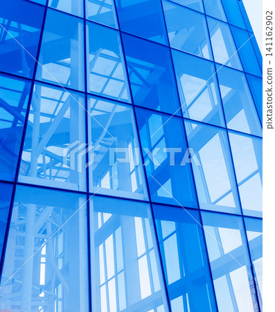 Abstract image of the glass facade of a modern building. Abstract image of the glass facade of a modern building. 141162902