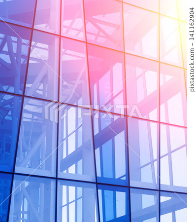 Abstract image of the glass facade of a modern building. Abstract image of the glass facade of a modern building. 141162904