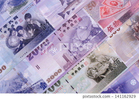 Taiwan, Taiwanese paper banknotes and coins, dollars of various denominations. Taiwanese dollars Taiwan, Taiwanese paper banknotes and coins, dollars of various denominations. Taiwanese dollars 141162929