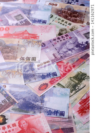 Taiwan, Taiwanese paper banknotes and coins, dollars of various denominations. Taiwanese dollars Taiwan, Taiwanese paper banknotes and coins, dollars of various denominations. Taiwanese dollars 141162971