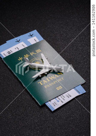 Taiwan, Taiwanese passport or id document with tickets for flight, travel. Taiwanese passport Taiwan, Taiwanese passport or id document with tickets for flight, travel. Taiwanese passport 141162986