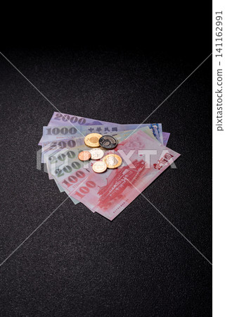 Taiwan, Taiwanese paper banknotes and coins, dollars of various denominations. Taiwanese dollars Taiwan, Taiwanese paper banknotes and coins, dollars of various denominations. Taiwanese dollars 141162991