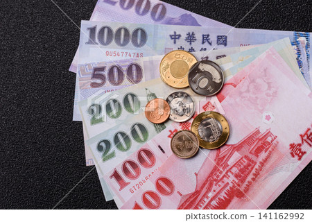 Taiwan, Taiwanese paper banknotes and coins, dollars of various denominations. Taiwanese dollars Taiwan, Taiwanese paper banknotes and coins, dollars of various denominations. Taiwanese dollars 141162992