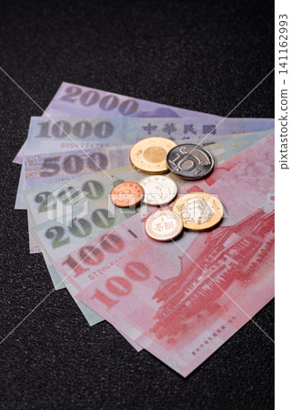 Taiwan, Taiwanese paper banknotes and coins, dollars of various denominations. Taiwanese dollars Taiwan, Taiwanese paper banknotes and coins, dollars of various denominations. Taiwanese dollars 141162993