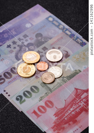 Taiwan, Taiwanese paper banknotes and coins, dollars of various denominations. Taiwanese dollars Taiwan, Taiwanese paper banknotes and coins, dollars of various denominations. Taiwanese dollars 141162996