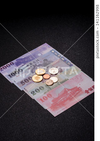 Taiwan, Taiwanese paper banknotes and coins, dollars of various denominations. Taiwanese dollars Taiwan, Taiwanese paper banknotes and coins, dollars of various denominations. Taiwanese dollars 141162998