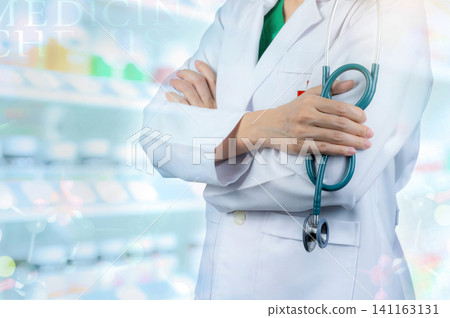 Doctor wears white uniform. Physician stand with arms crossed and hand holding stethoscope. Healthcare professional. Doctor stand with confidence on blurred drug shelves and drug chemical structures. Doctor wears white uniform. Physician stand with arms crossed and hand holding stethoscope. Healthcare professional. Doctor stand with confidence on blurred drug shelves and drug chemical structures. 141163131