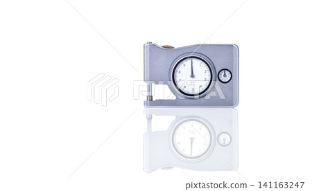 Micrometer thickness gauge. Dial thickness gauge. Handy for measuring thickness of small parts, metal, rubber, vinyl, paper, foil and other sheet material. Measuring equipment. Measurement tool. 141163247