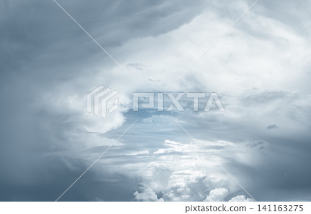 Heaven sky and white clouds. Heaven sky with light in center and dark frame. Spiritual religious background. Beautiful natural pattern of fluffy clouds. God light and planet earth concept. Bright sky. Heaven sky and white clouds. Heaven sky with light in center and dark frame. Spiritual religious background. Beautiful natural pattern of fluffy clouds. God light and planet earth concept. Bright sky. 141163275