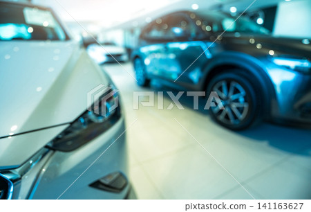 Blurred SUV car parked in modern showroom. Car dealership and auto leasing concept. Automotive industry. Modern luxury showroom. Front view new car parked in showroom. Electric automobile technology. Blurred SUV car parked in modern showroom. Car dealership and auto leasing concept. Automotive industry. Modern luxury showroom. Front view new car parked in showroom. Electric automobile technology. 141163627