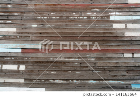 Brown wooden wall texture background. Empty old wood plank surface texture background. Timber wooden wall with brown, blue, and white colors. Exterior design. Wooden wall with nails. Weathered wood. Brown wooden wall texture background. Empty old wood plank surface texture background. Timber wooden wall with brown, blue, and white colors. Exterior design. Wooden wall with nails. Weathered wood. 141163664