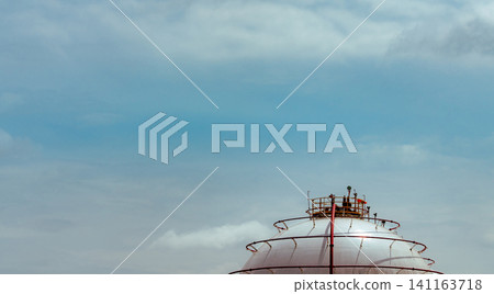 Industrial gas storage tank. LNG or liquefied natural gas storage tank. Spherical gas tank in petroleum refinery. Above-ground storage tank. Natural gas storage industry and global market consumption Industrial gas storage tank. LNG or liquefied natural gas storage tank. Spherical gas tank in petroleum refinery. Above-ground storage tank. Natural gas storage industry and global market consumption 141163718