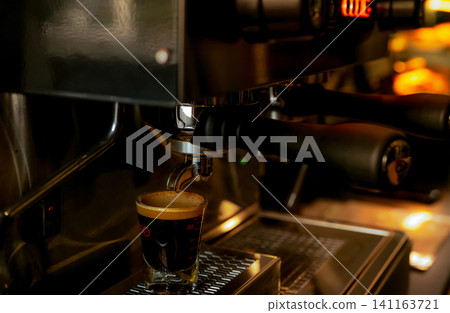 Closeup professional coffee machine in coffee shop. Coffee maker for make espresso, americano, latte, and cappuccino. Counter bar of coffee shop. Modern tool for barista. Beverage service business. Closeup professional coffee machine in coffee shop. Coffee maker for make espresso, americano, latte, and cappuccino. Counter bar of coffee shop. Modern tool for barista. Beverage service business. 141163721
