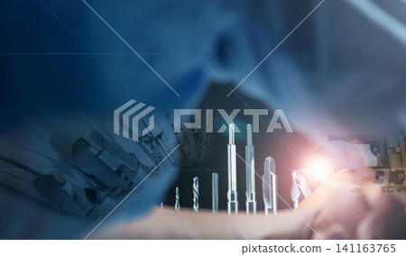Special tools. Carbide cutting tools for industrial applications. Made to order special tools. Drill, reamer, robotic hand machine. HSS cemented carbide view from space between armpits of engineer. Special tools. Carbide cutting tools for industrial applications. Made to order special tools. Drill, reamer, robotic hand machine. HSS cemented carbide view from space between armpits of engineer. 141163765