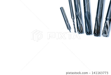 Special tools isolated on white background. Made to order special tools. Coated step drill and reamer detail. HSS cemented carbide. Carbide cutting tool for industrial applications. Engineering tools. Special tools isolated on white background. Made to order special tools. Coated step drill and reamer detail. HSS cemented carbide. Carbide cutting tool for industrial applications. Engineering tools. 141163773