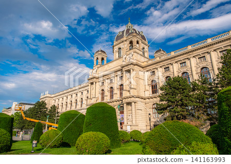 Vienna, Austria: The exterior of the Kunsthistorisches Museum Vienna stands out against the blue sky and lush gardens. Vienna, Austria: The exterior of the Kunsthistorisches Museum Vienna stands out against the blue sky and lush gardens. 141163993