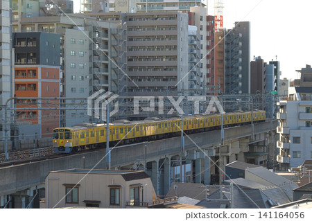 A Seibu Ikebukuro Line 2000 series train traveling on an elevated quadruple track (Nerima Ward, Tokyo) 141164056