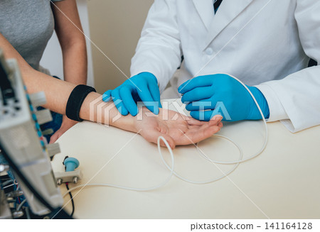 Patient nerves testing using electromyography. EMG 141164128