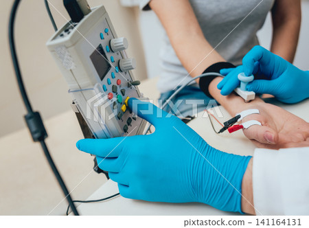 Patient nerves testing using electromyography. EMG 141164131