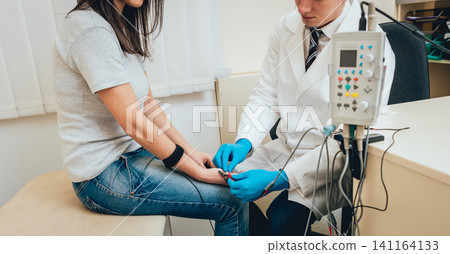 Patient nerves testing using electromyography. EMG Patient nerves testing using electromyography. EMG 141164133