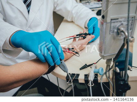 Patient nerves testing using electromyography. EMG 141164136