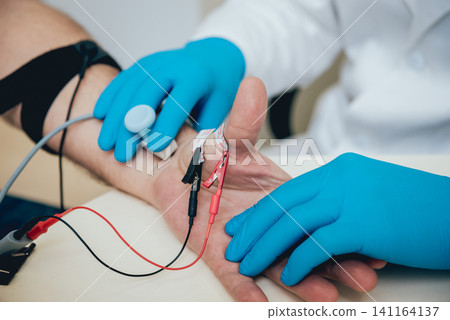 Patient nerves testing using electromyography. EMG Patient nerves testing using electromyography. EMG 141164137