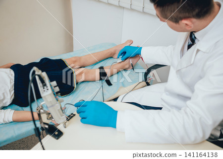 Patient nerves testing using electromyography. EMG Patient nerves testing using electromyography. EMG 141164138