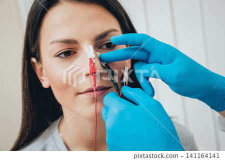 Patient nerves testing using electromyography. EMG Patient nerves testing using electromyography. EMG 141164141