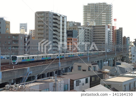 A Seibu Ikebukuro Line 30000 series train travels along the elevated quadruple track. A Seibu Ikebukuro Line 30000 series train travels along the elevated quadruple track. 141164150