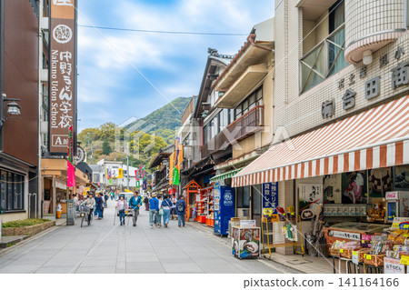 A scene of souvenir shops and tourists lining the main approach to Kotohira Shrine in Kotohira Town, Kagawa Prefecture. A scene of souvenir shops and tourists lining the main approach to Kotohira Shrine in Kotohira Town, Kagawa Prefecture. 141164166