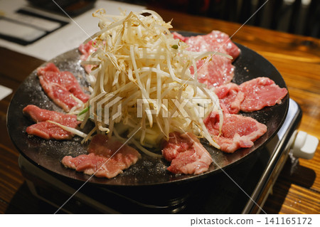 Before putting the Genghis Khan (Mongolian barbecue) pot on the fire 141165172