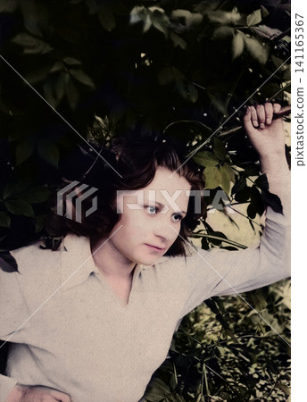 Young Soviet Woman Posing Among Garden Foliage in 1936 Young Soviet Woman Posing Among Garden Foliage in 1936 141165367