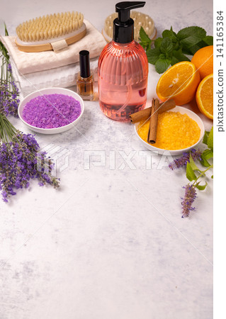 Spa wellness items with lavender and orange bath salts 141165384