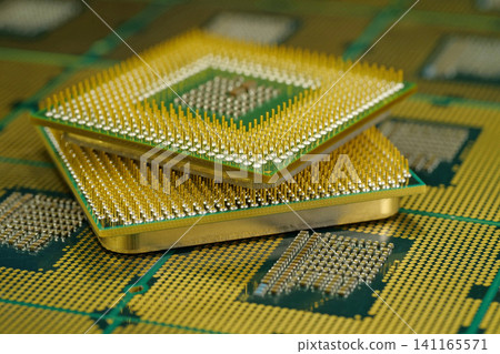 Macro photography of central processing unit showing metal pins Macro photography of central processing unit showing metal pins 141165571