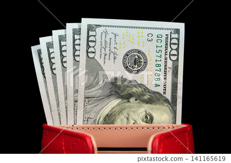A luxury leather wallet with a five new hundred-dollar bills inside A luxury leather wallet with a five new hundred-dollar bills inside 141165619