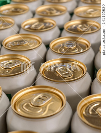 Golden carbonated beverage cans displayed in organized rows on supermarket shelves for shoppers Golden carbonated beverage cans displayed in organized rows on supermarket shelves for shoppers 141165620