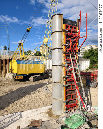 Construction site where bridge pier forming uses modular reusable shuttering highlighting industrial infrastructure construction and precise engineering operations Construction site where bridge pier forming uses modular reusable shuttering highlighting industrial infrastructure construction and precise engineering operations 141165677