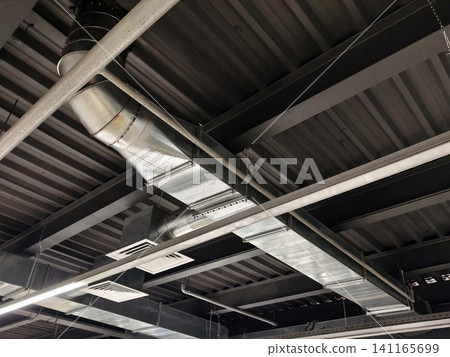 High ceiling of production hall with metal pipelines integrated with ventilation for air distribution and safety compliance High ceiling of production hall with metal pipelines integrated with ventilation for air distribution and safety compliance 141165699