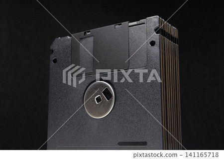 Collection of black floppy disks from the 1990s technology era Collection of black floppy disks from the 1990s technology era 141165718