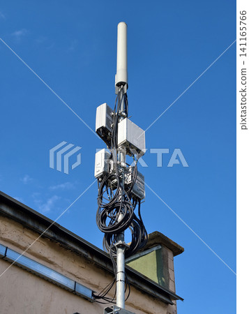 5G tower with antennas and extensive cabling used for network coverage 5G tower with antennas and extensive cabling used for network coverage 141165766