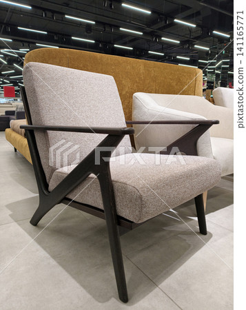 Wooden armrests and plush seating make this armchair perfect for any living room in the megastore Wooden armrests and plush seating make this armchair perfect for any living room in the megastore 141165771